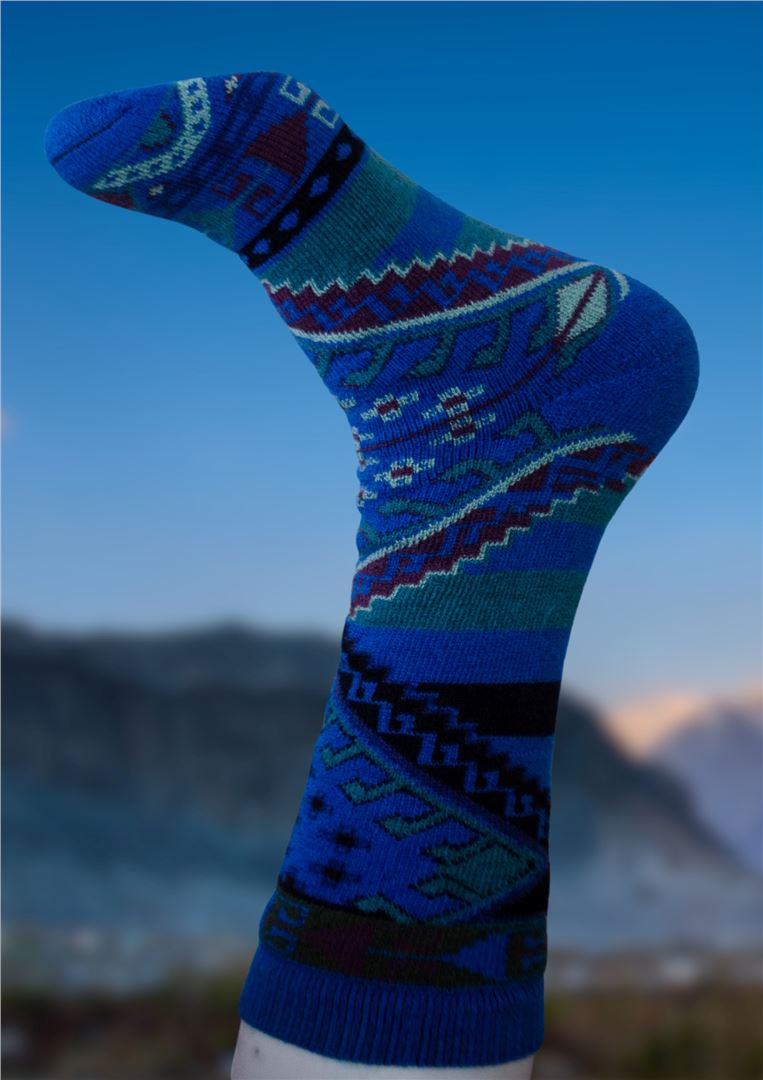 Blue alpaca sock with patterned bands and diamond details