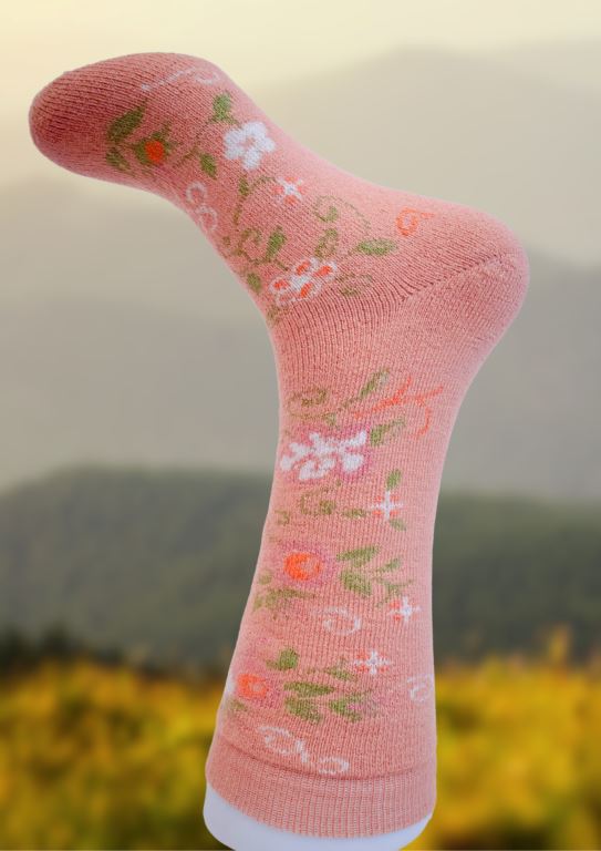 Pink alpaca socks with subtle floral and dot pattern