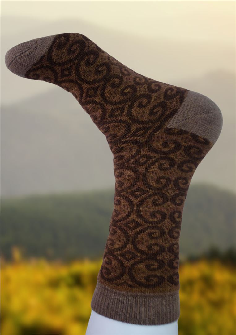 Alpaca socks in taupe brown with dark brown swirling pattern and ribbed cuff.