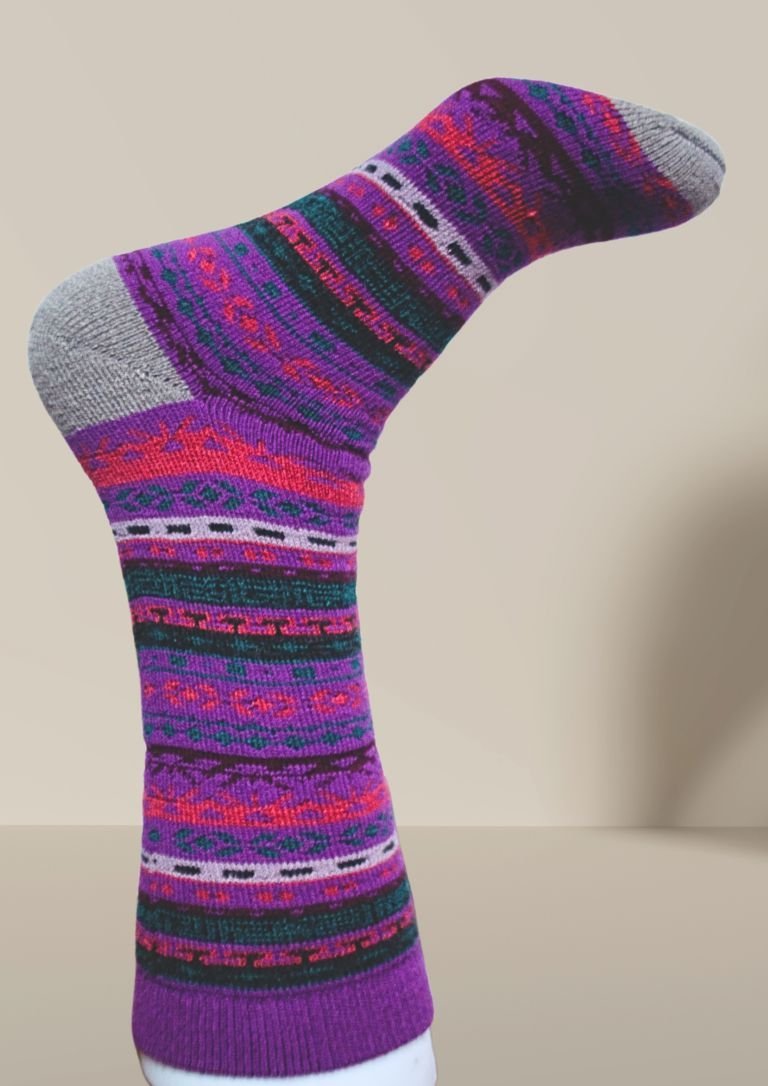Purple patterned alpaca socks with multicolor stripe bands and gray toe