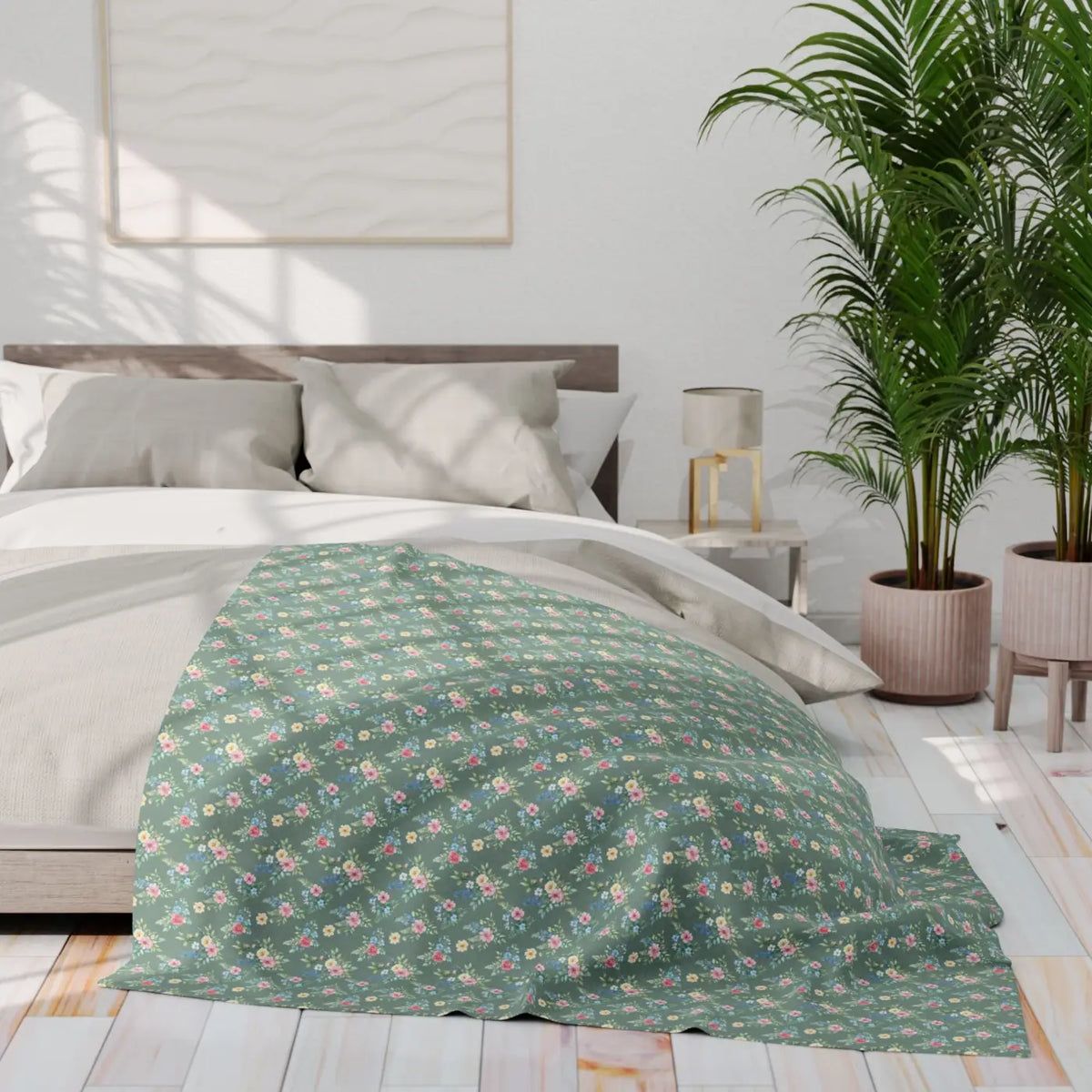 Floral pastel fleece blanket on bed, green ground with small pink and blue flower pattern