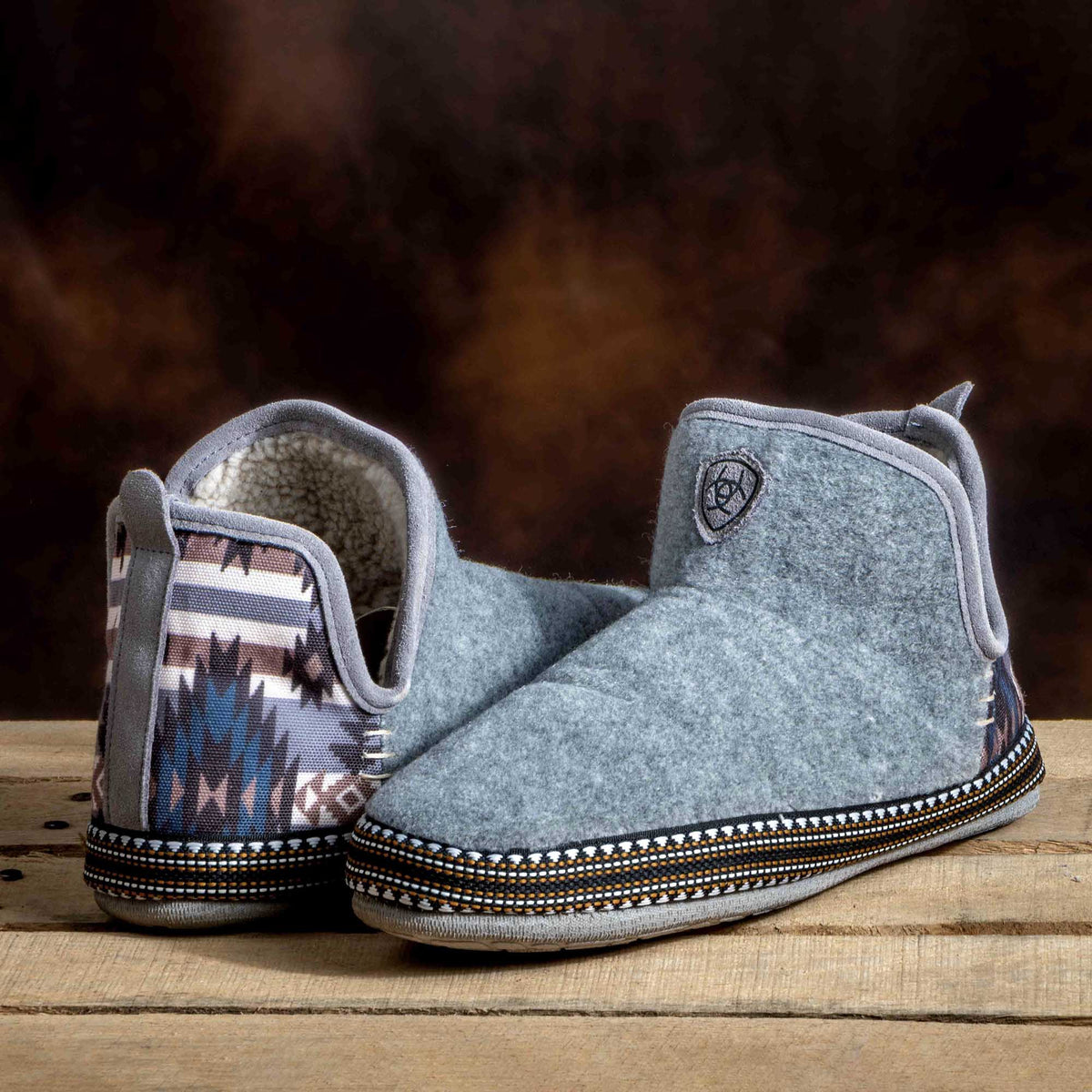 Denim wool-blend bootie slippers showing patterned inner lining and beaded trim