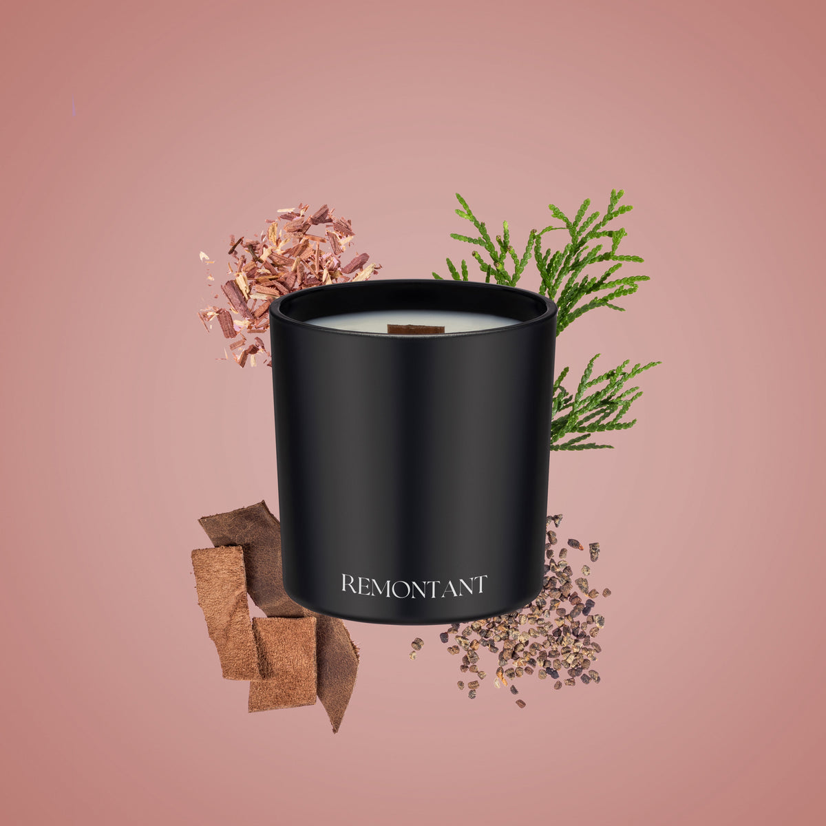 Black glass wood wick candle with Remontant label, surrounded by dried botanicals
