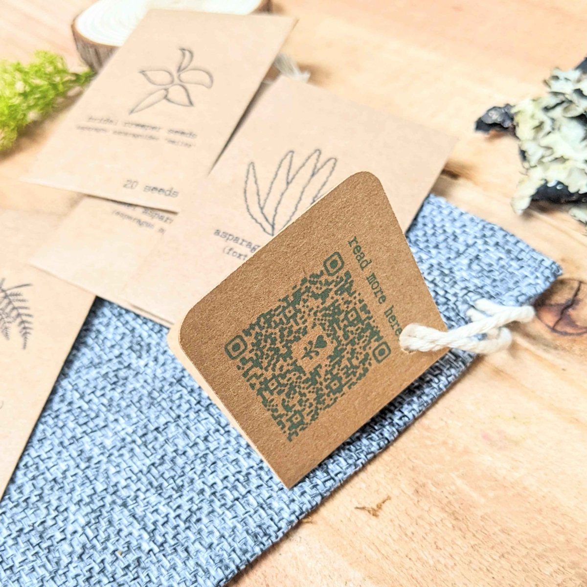 Fern seed packet bundle with kraft labels, twine tie, and QR-style code tag