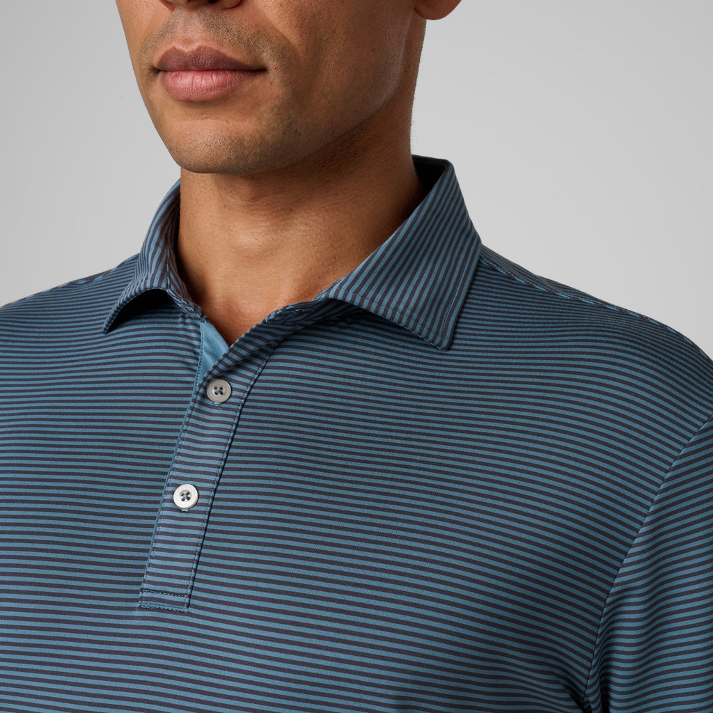 Storm blue striped polo with spread collar and two-button placket detail.