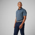 Men's athletic polo shirt in storm blue with striped pattern, button placket and collar.