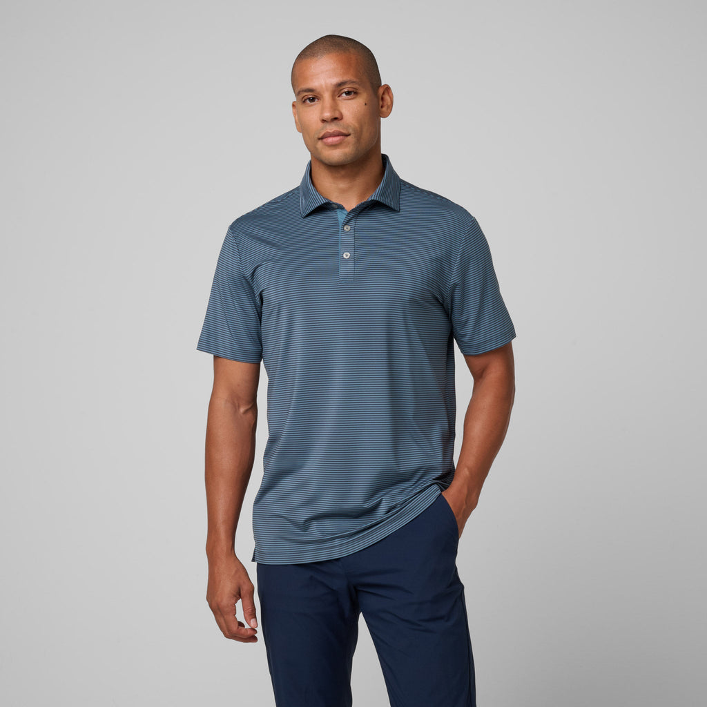 Storm blue athletic polo shirt with subtle stripe texture and short-sleeve collar.