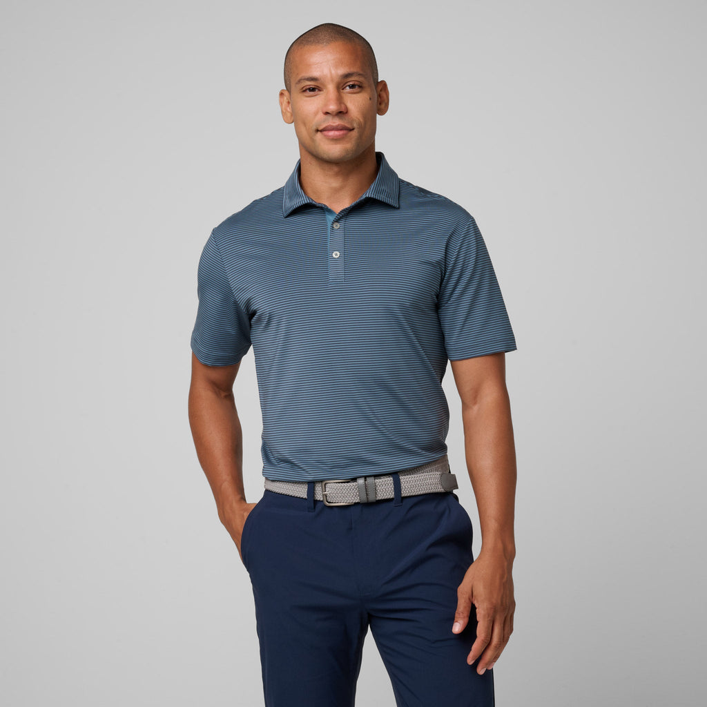 Storm blue athletic polo with short sleeves, three-button placket, and subtle stripe texture.