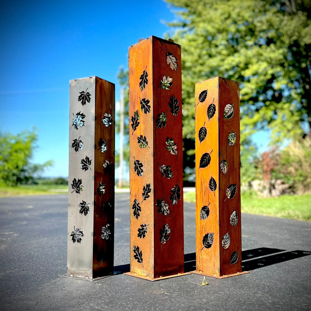 Rectangular solar pillar luminary set with leaf cutout designs on metal panels