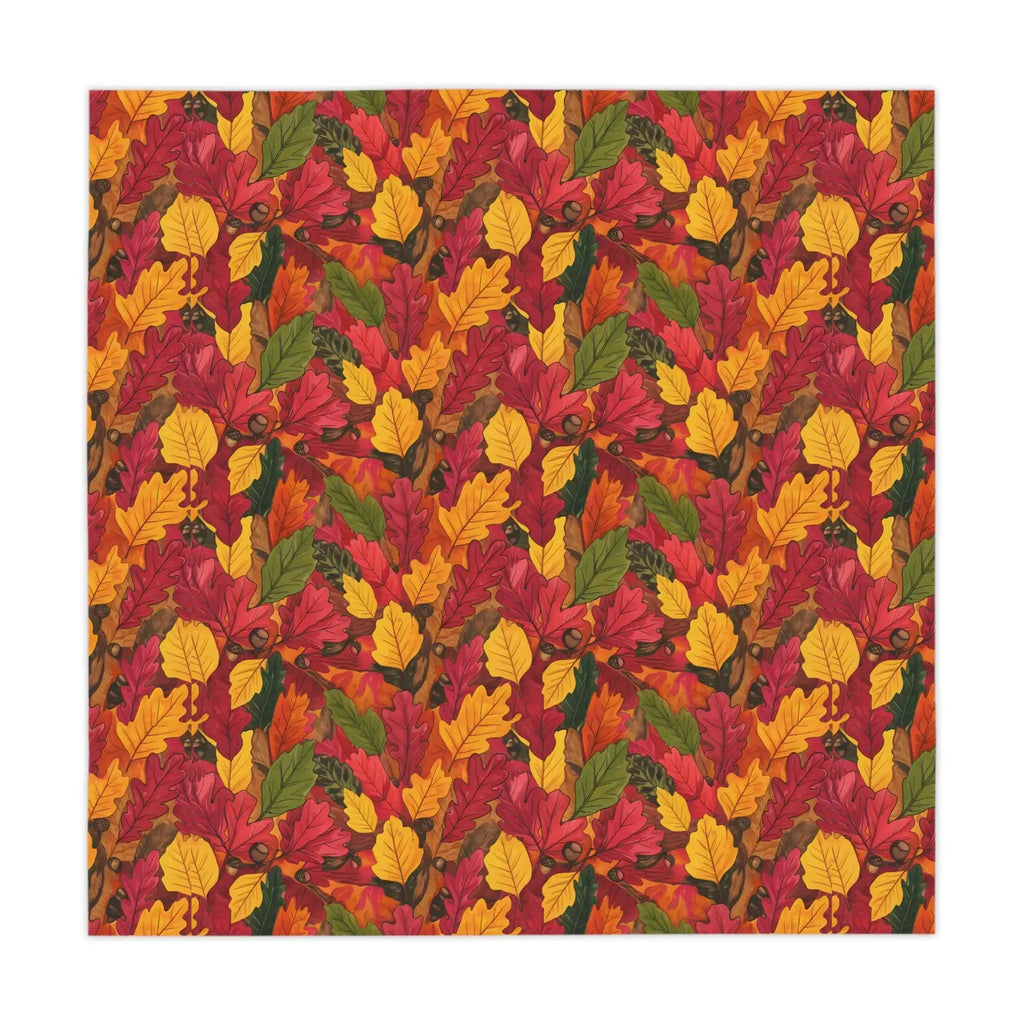 Leaf-patterned tablecloth fabric with red, yellow, and green autumn foliage