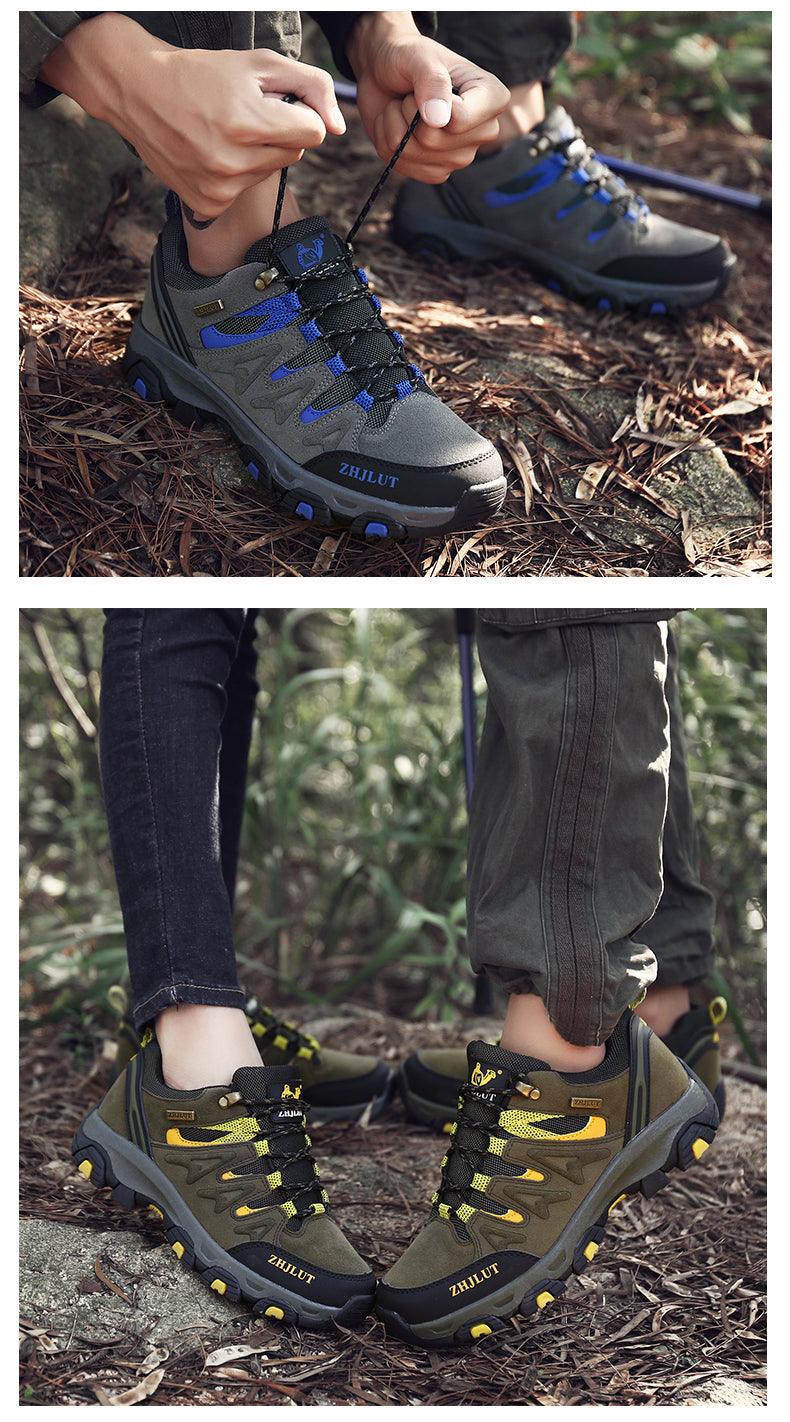 Outdoor hiking shoes on ground, dark olive with blue laces and rugged tread