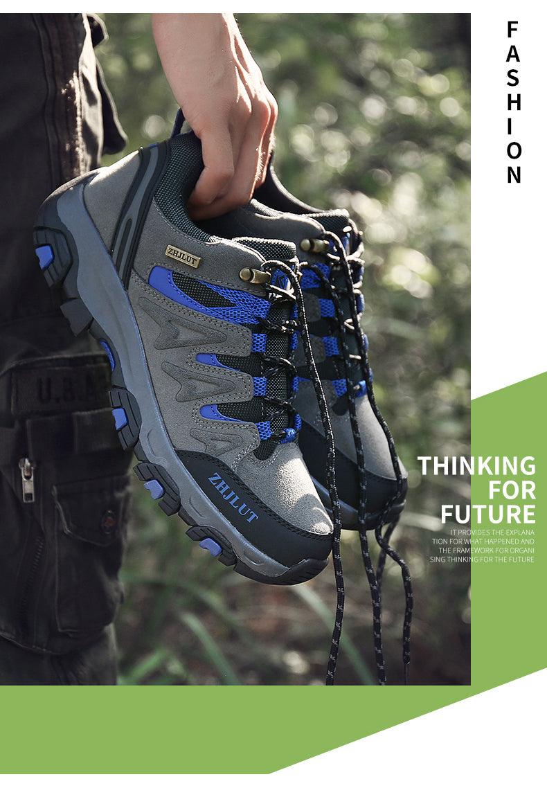Blue and gray low-top hiking shoes with dark laces, worn with traction sole