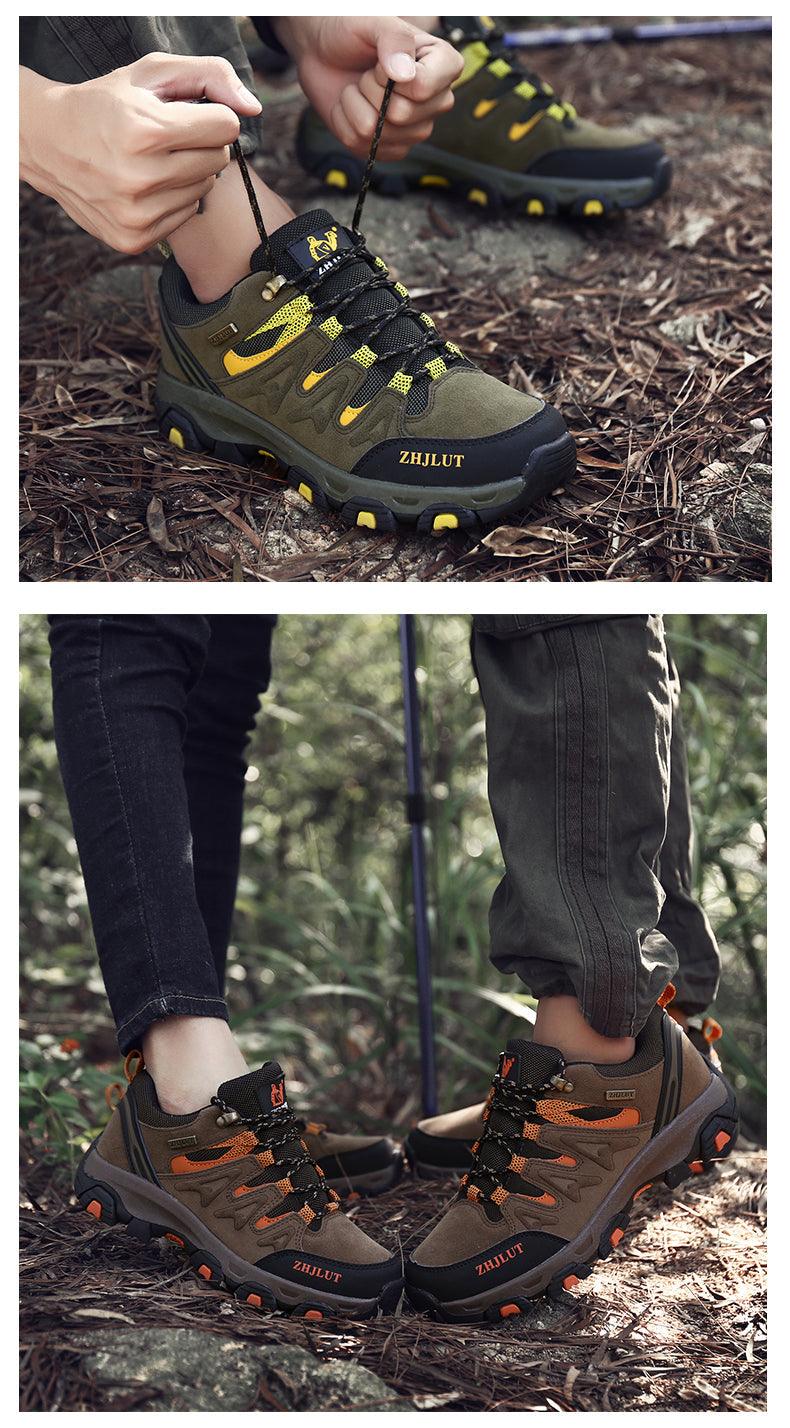 Outdoor hiking shoes on ground, dark olive with yellow laces and rugged tread