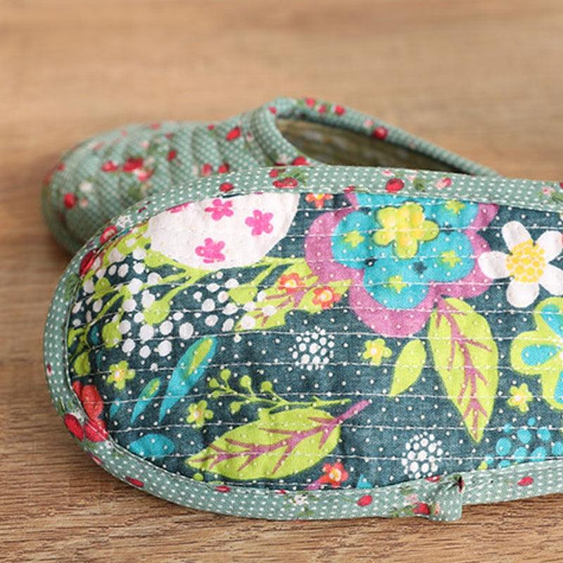Women's slip-on indoor slippers with colorful floral patchwork and green dotted trim