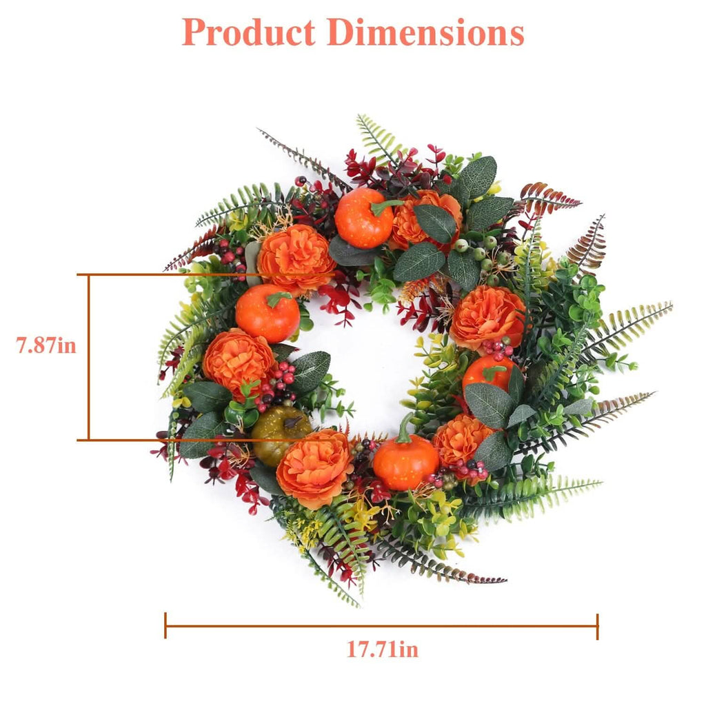 Autumn wreath top view with orange pumpkins, orange flowers, red berries, and green fern leaves