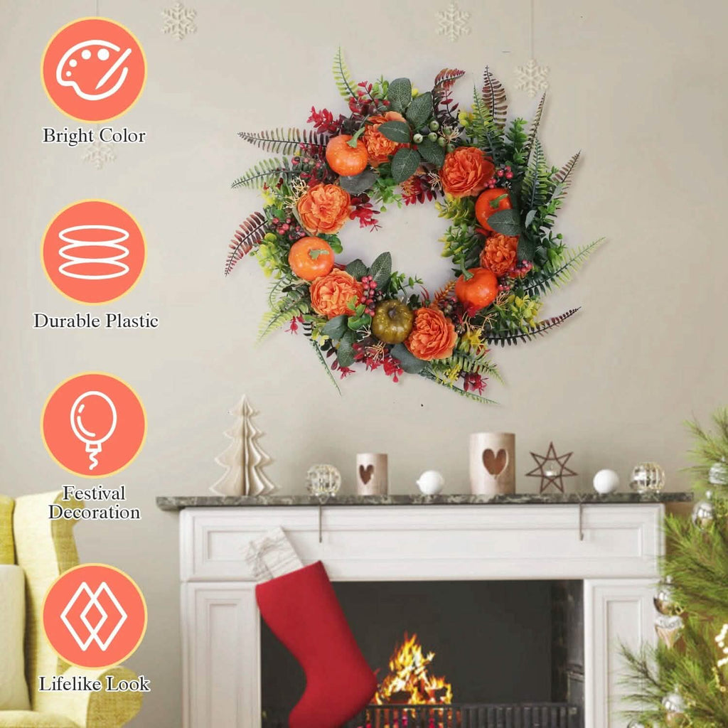 Autumn wreath centered view with orange pumpkins, orange flowers, red berries, and green leaves