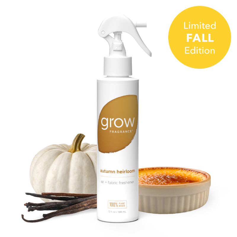 Air and fabric spray bottle with amber 'grow' label and small pumpkin and candle