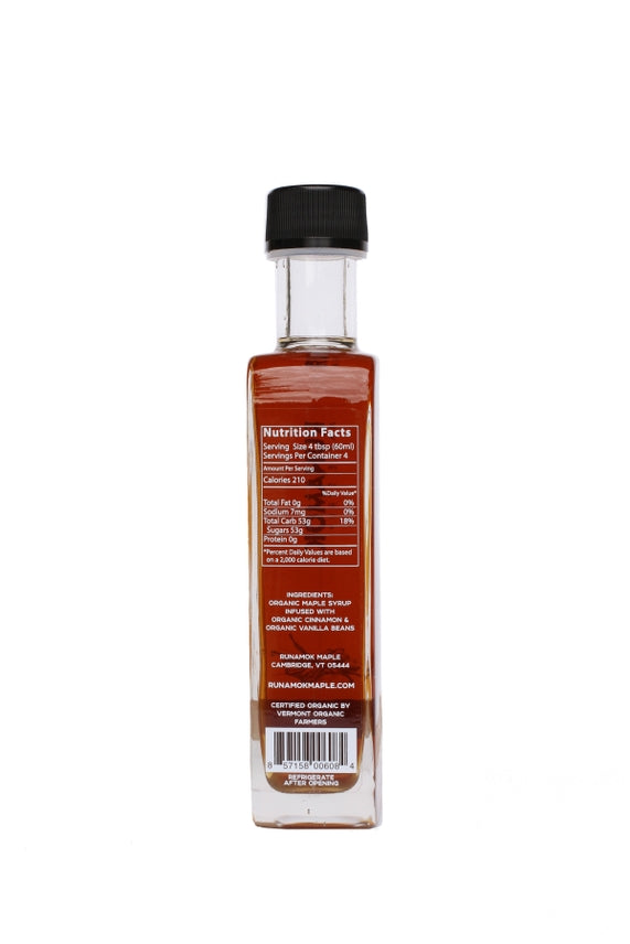 Cinnamon-vanilla maple syrup bottle back with nutrition facts label on clear bottle