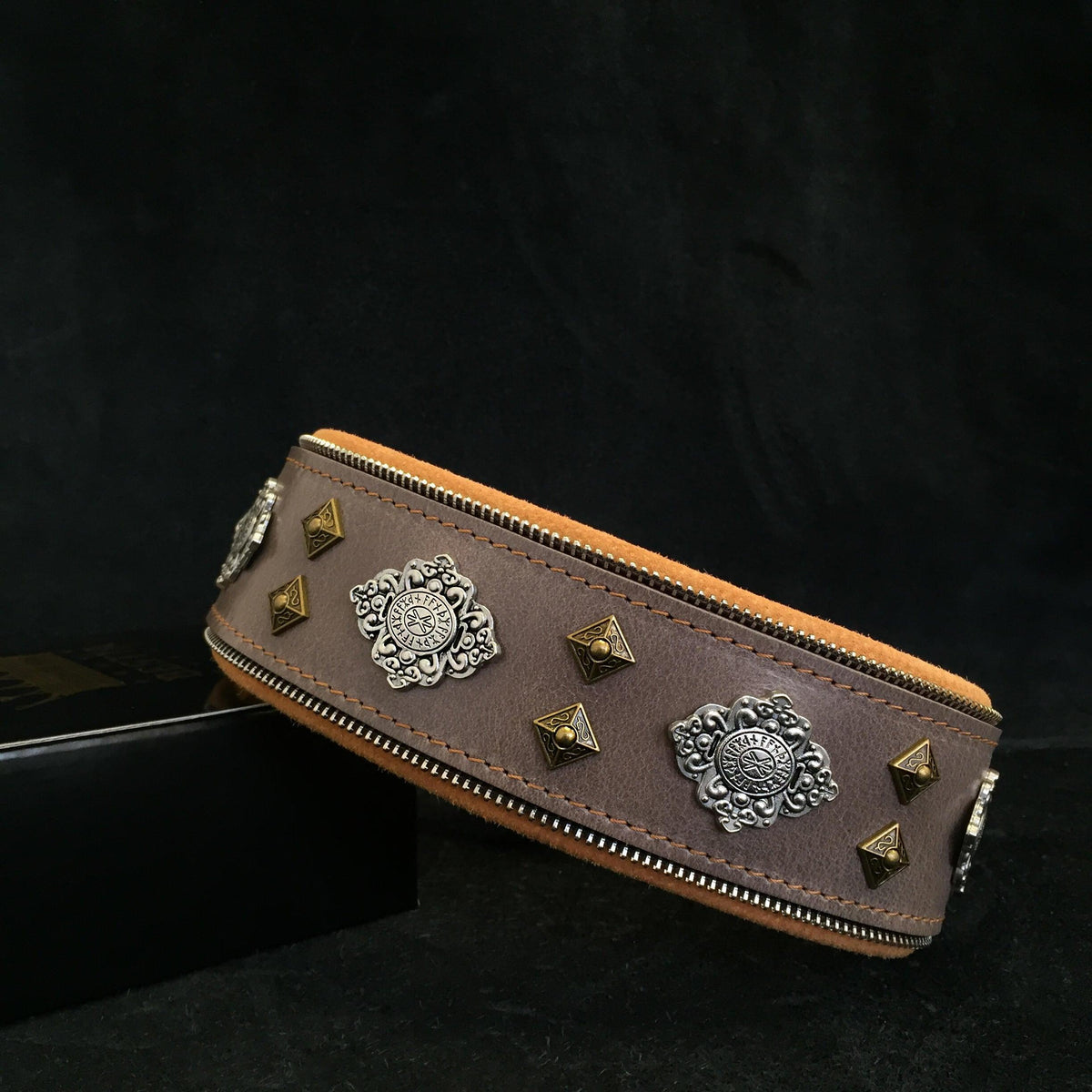 Brown leather dog collar with silver concho medallions, pyramid studs, stitched edge