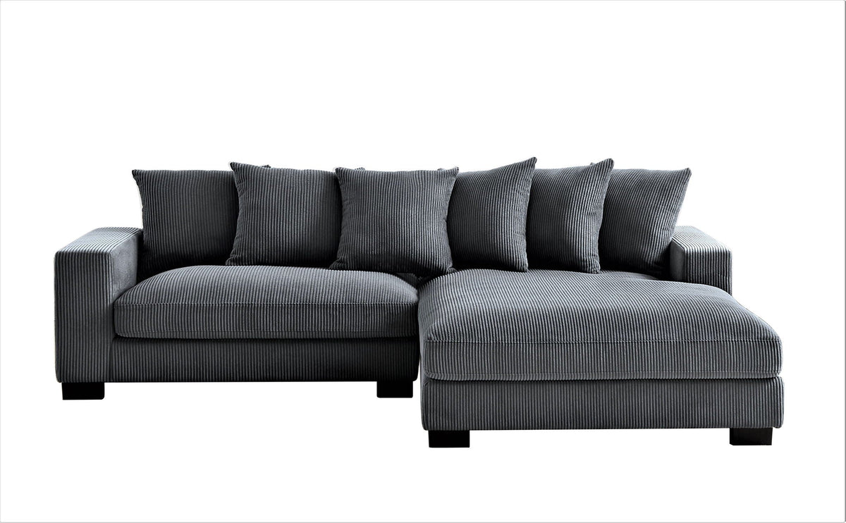 L-shaped sectional sofa with chaise in dark gray, tufted look and cushioned back pillows