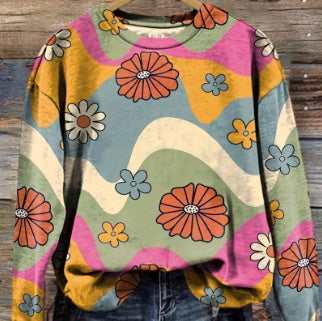 Women's round-neck sweater close-up with multicolor flower and swirl print