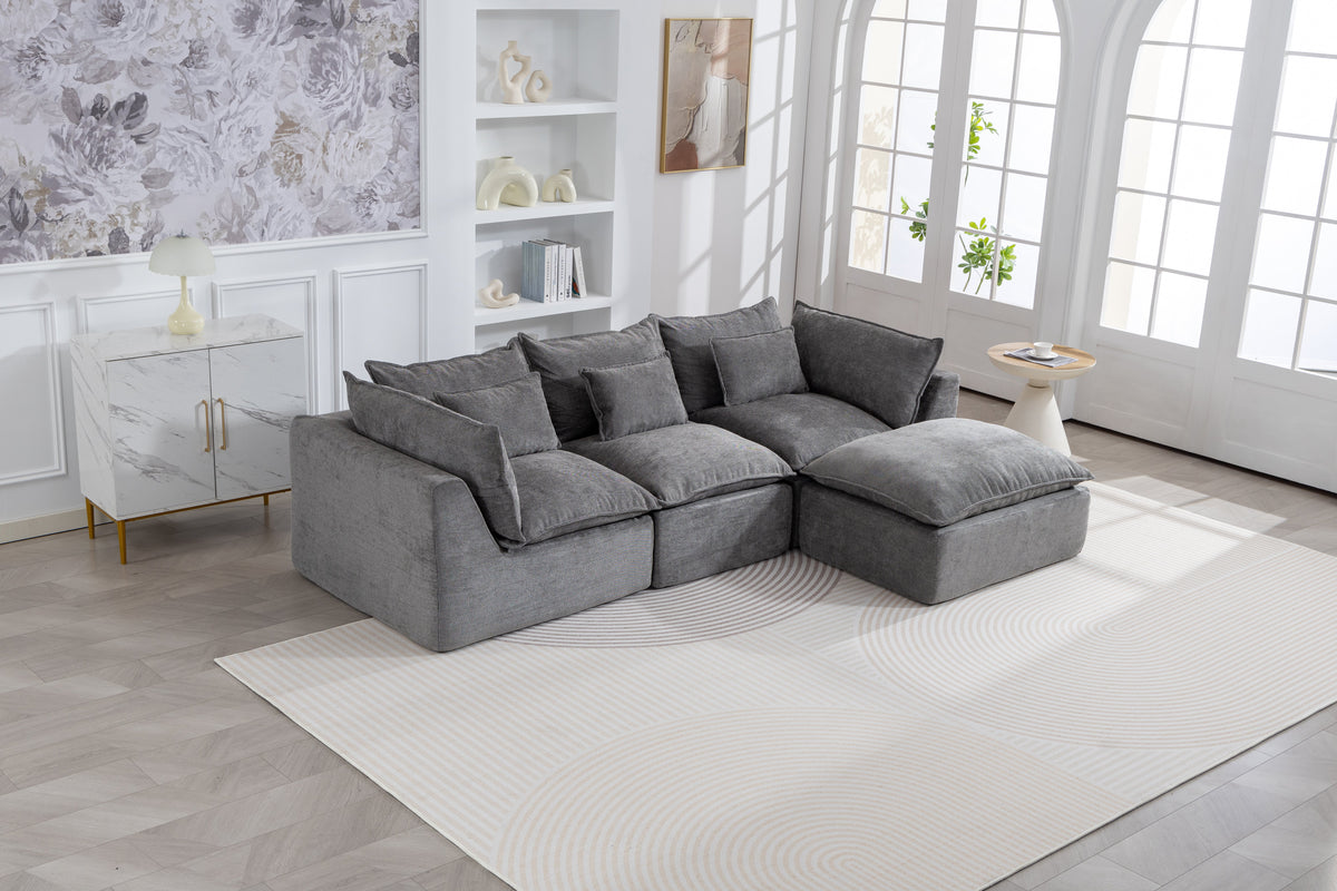 Gray modular sectional sofa with corner chaise and several matching throw pillows