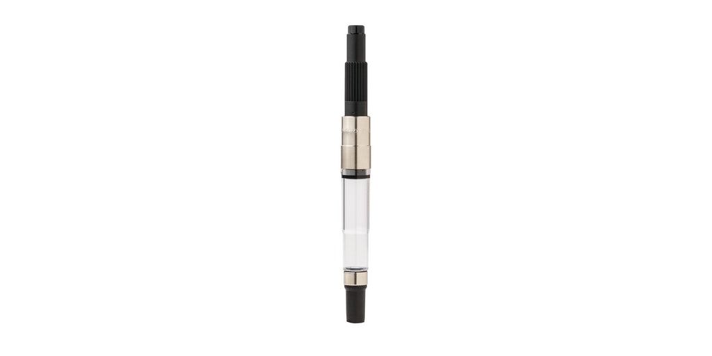Fountain pen converter with clear barrel and black push-in end, metal connector