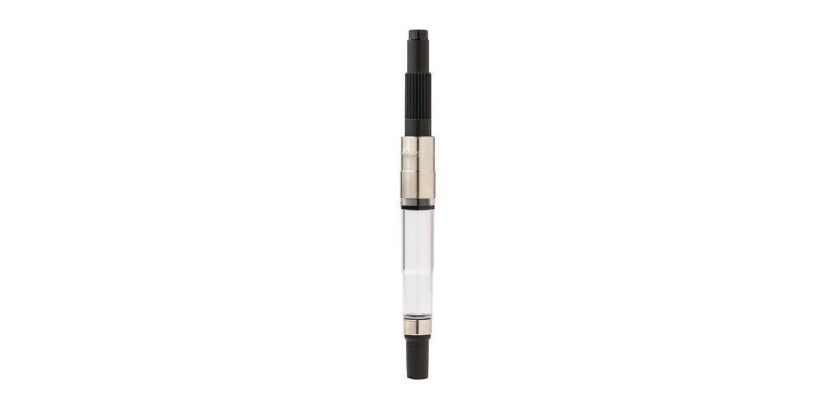 Fountain pen converter with clear barrel and black push-in end, metal connector