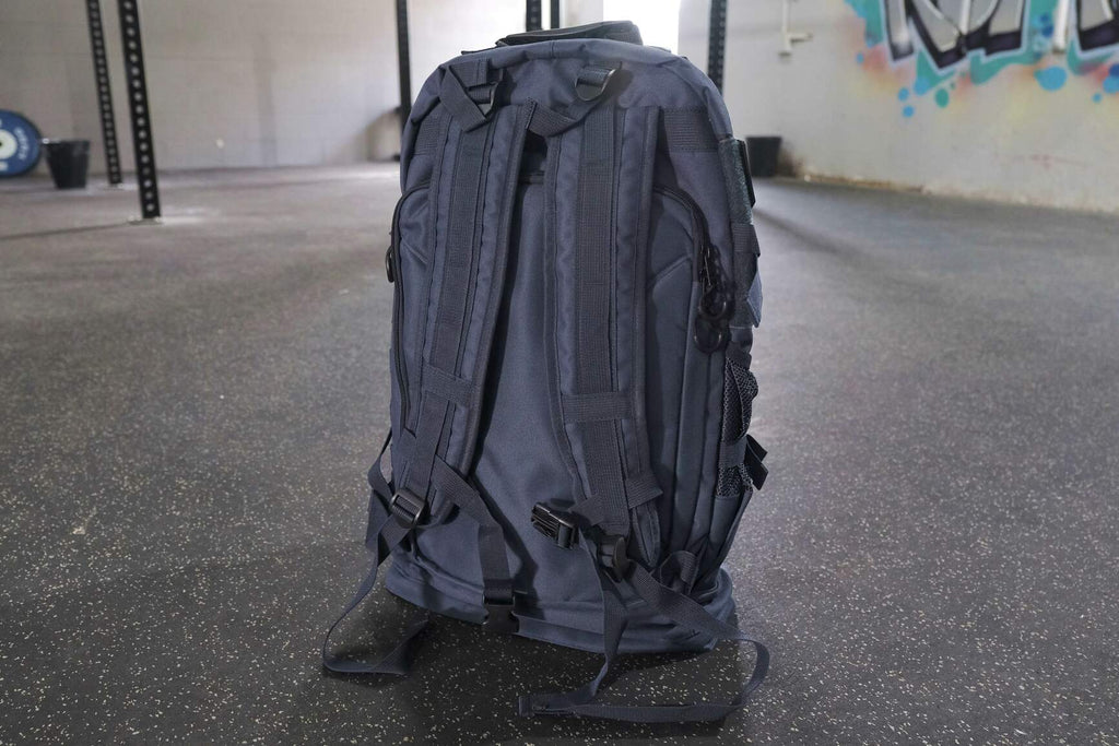 BKX navy blue military backpack rear view with layered panels and trekking-style straps