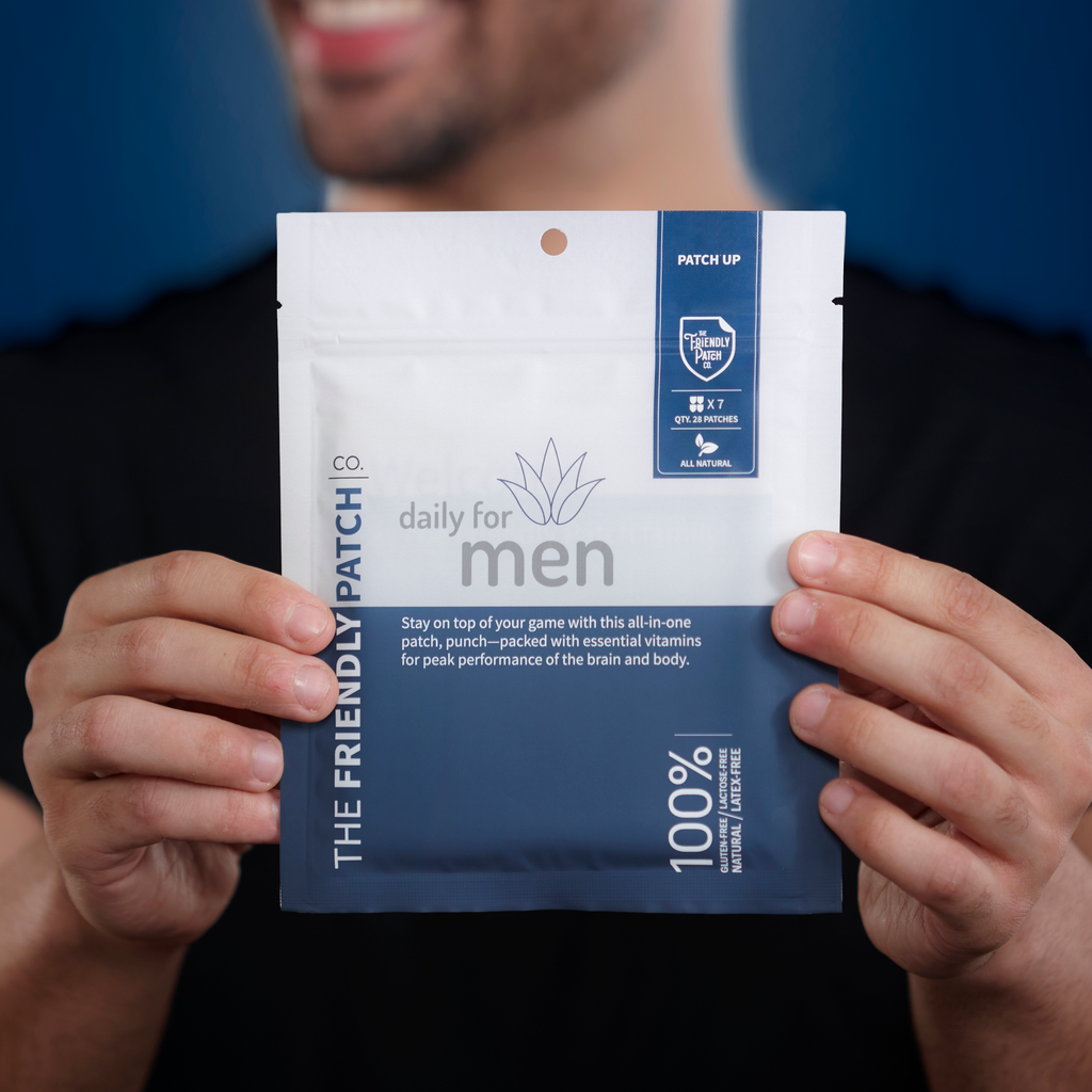 Men’s vitamin patch pouch held up, showing “daily for men” and “100%” text