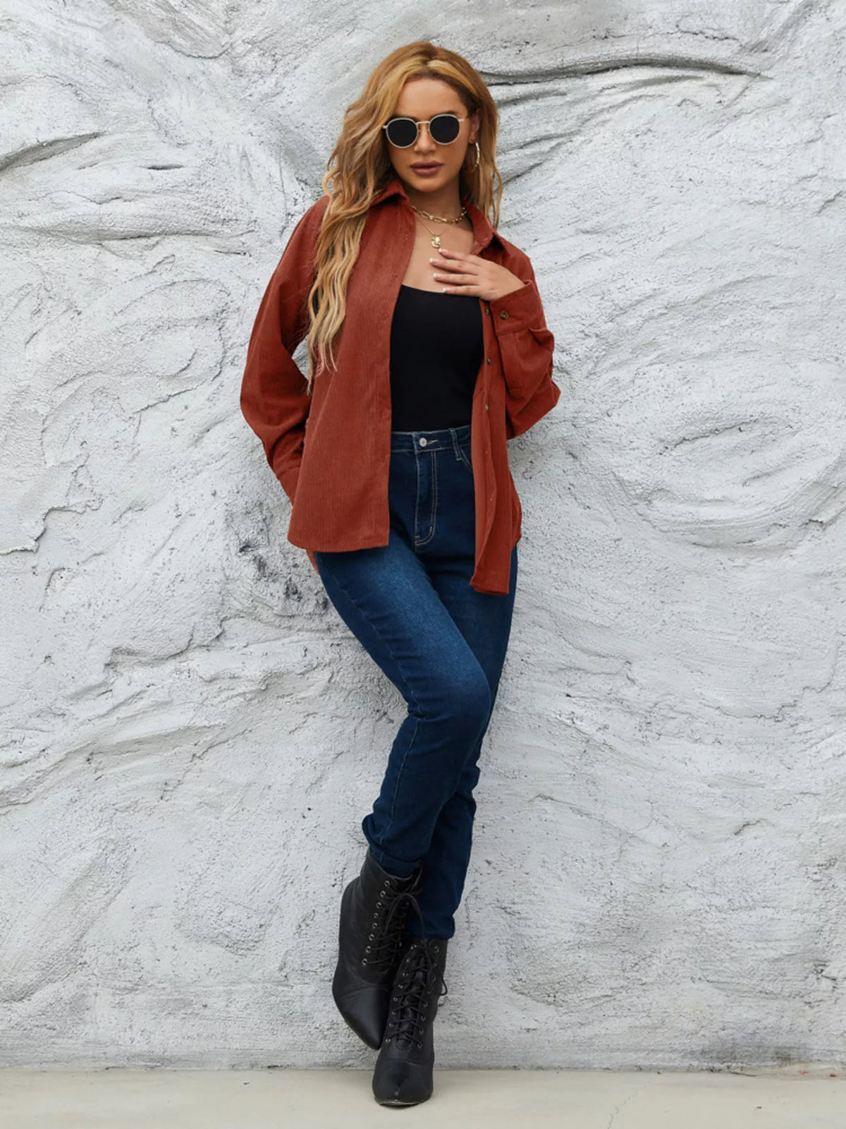 Rust-orange corduroy button-up shirt with button front and a chest pocket