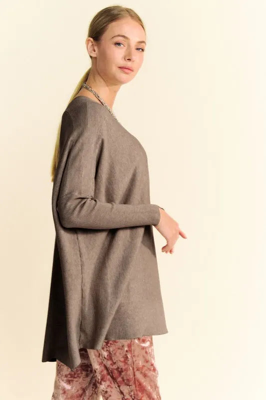 Coffee brown knit top with round neck, dropped shoulders, and long sleeves