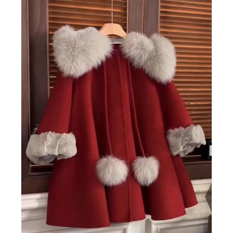 Red wool coat with fur collar, sleeve cuffs, and matching hem fur accents