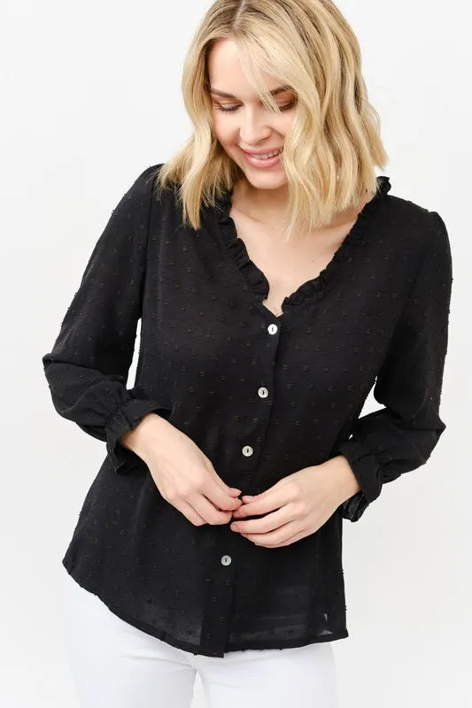Black polka-dot blouse with ruffle neckline, button front, and gathered sleeves