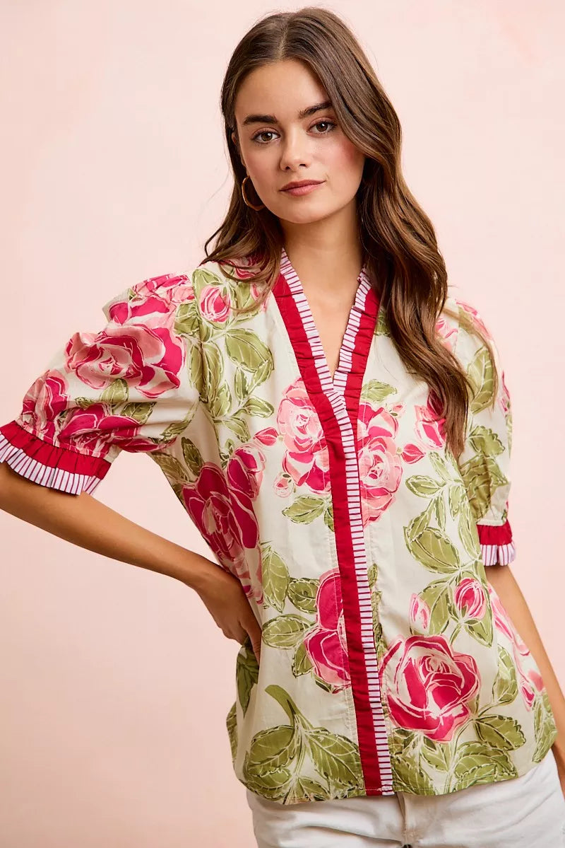 Floral woven blouse in white with coral contrast edge and short ruffled sleeves