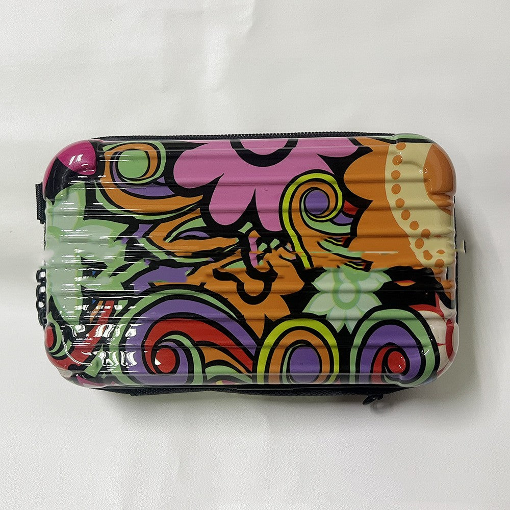 Zippered cosmetic bag with multicolor abstract pattern and black trim, two metal pull tabs