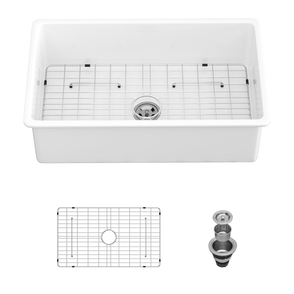 White rectangular single-bowl ceramic kitchen sink with raised grid and drain outlet