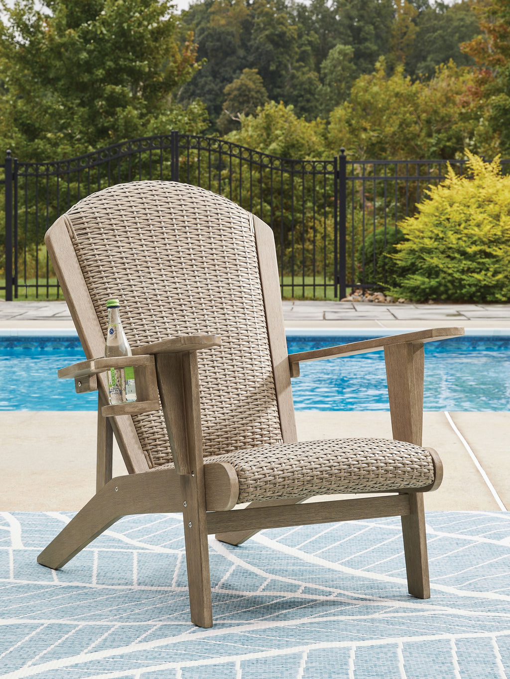 Beige woven Adirondack chair with angled seat and curved back