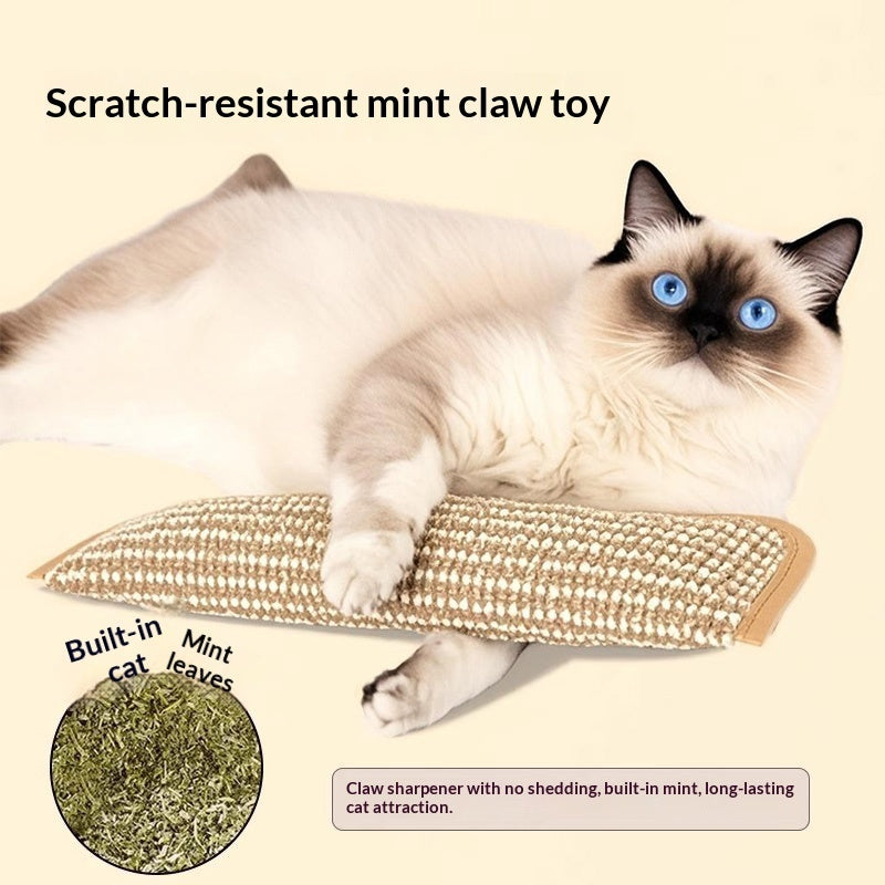 Beige woven catnip pillow with green mint-leaf filling, with a cat paw resting on it.