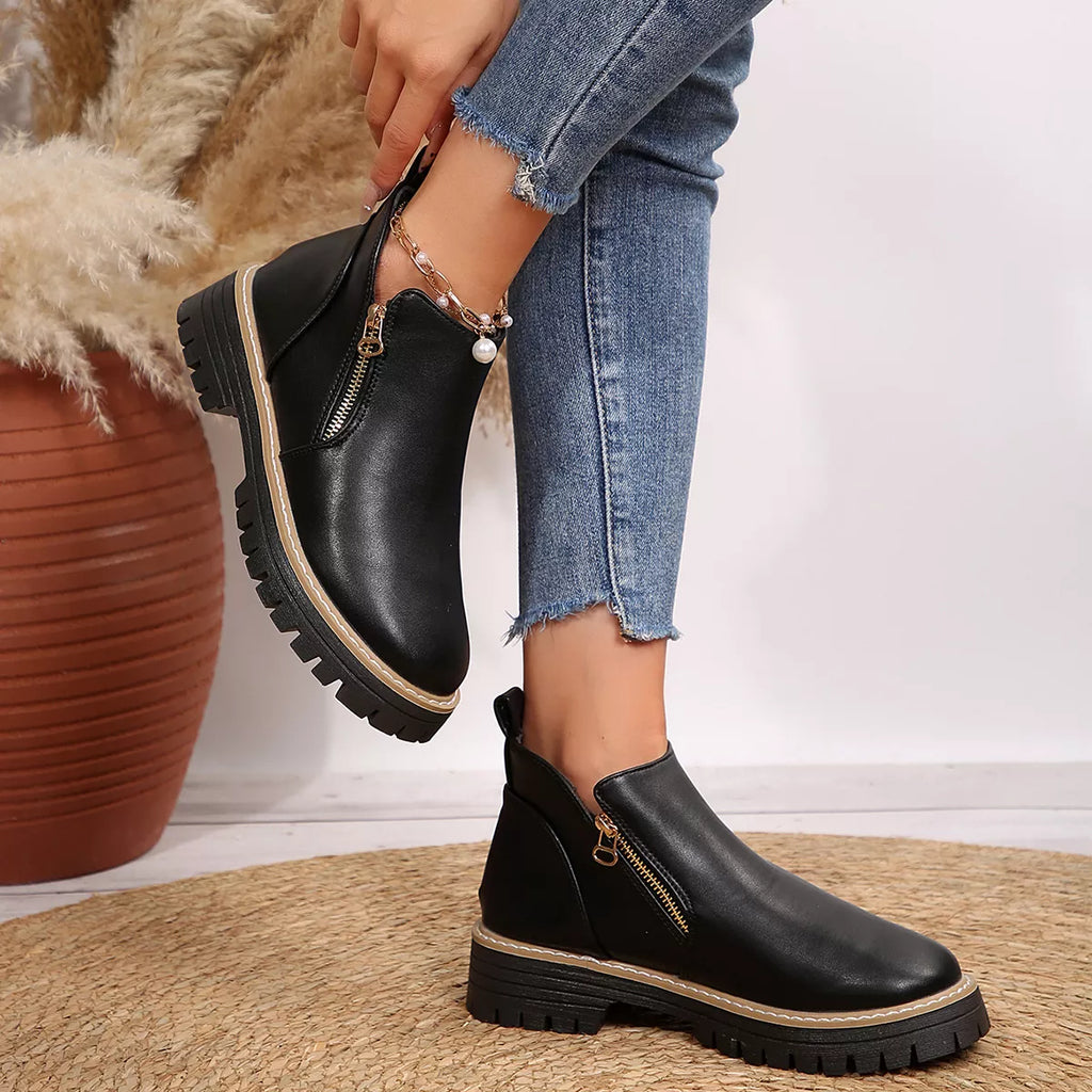 Black ankle boots with side zipper and low platform lug sole