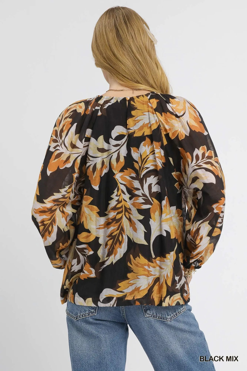 Back view of leaf-print balloon sleeve blouse, black mix