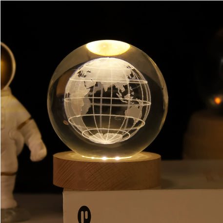 Clear globe LED night light with grid lines on round wooden base