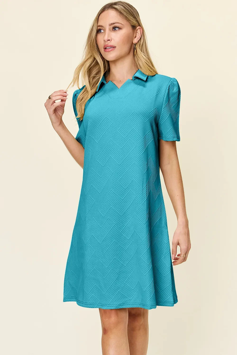 Teal textured collared short-sleeve dress with V neckline and relaxed fit.