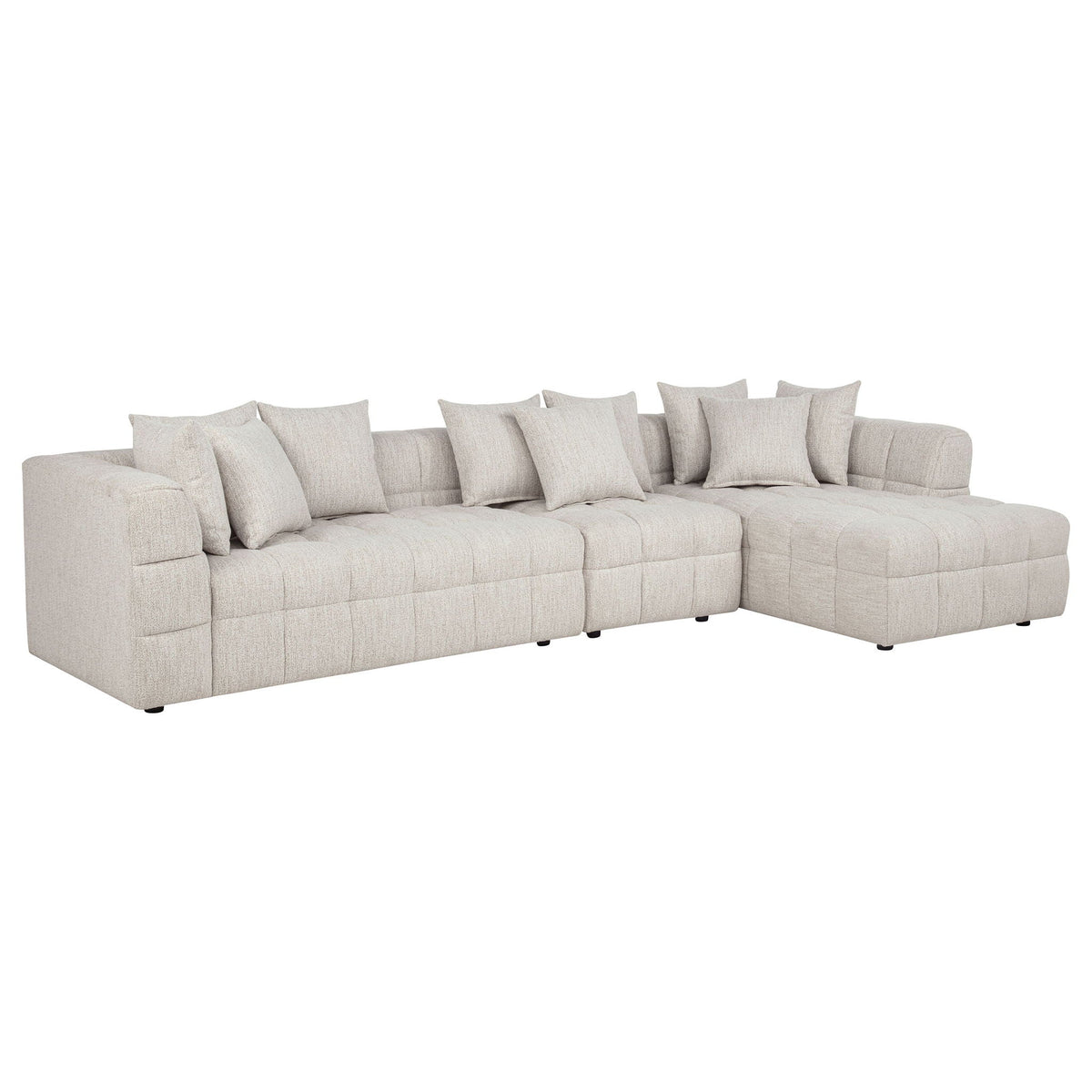 Light beige 3-piece sectional sofa with chaise, tufted cushions, and five throw pillows