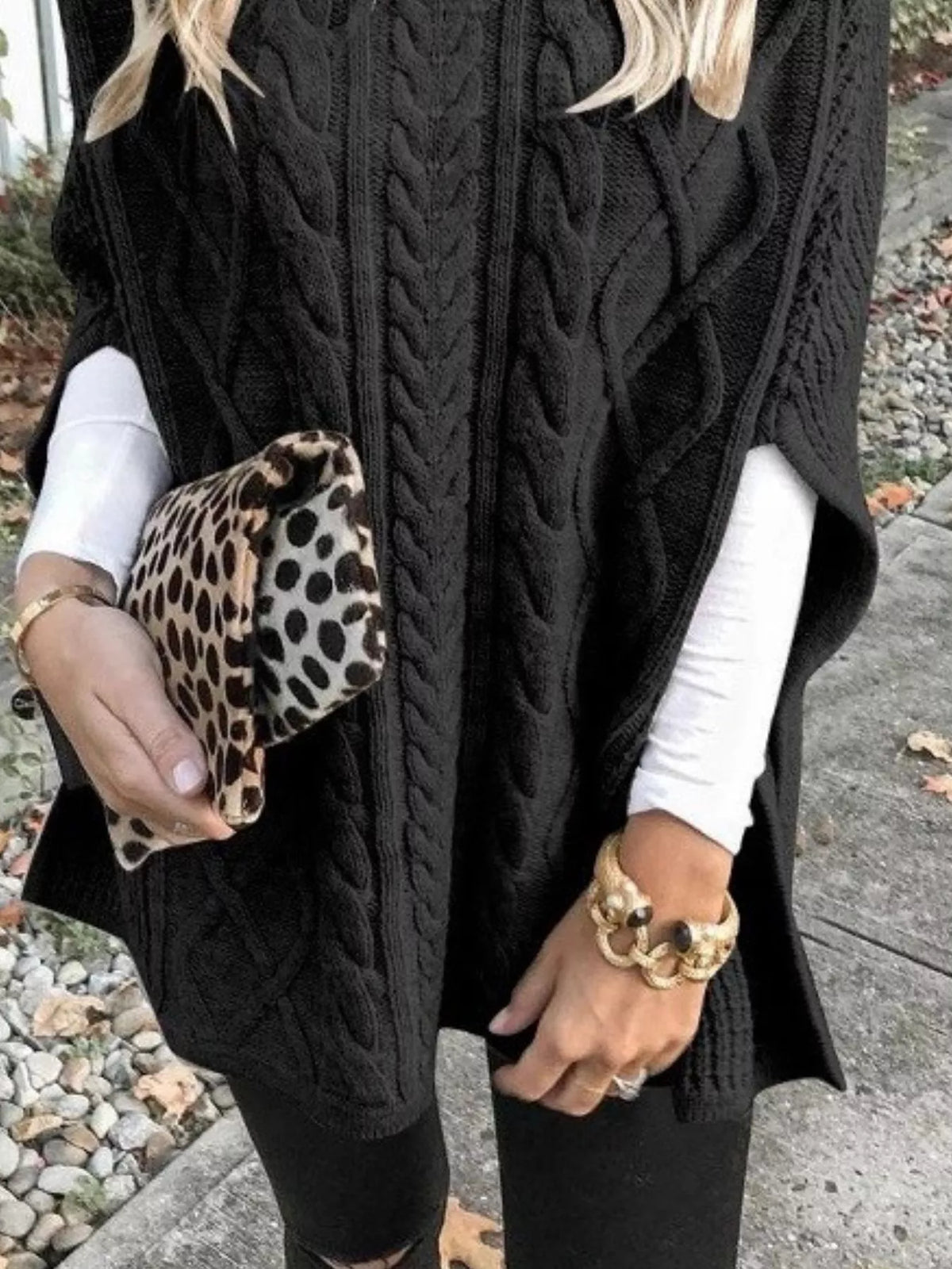 Black cable-knit turtleneck poncho cover-up with textured cable knit and drape