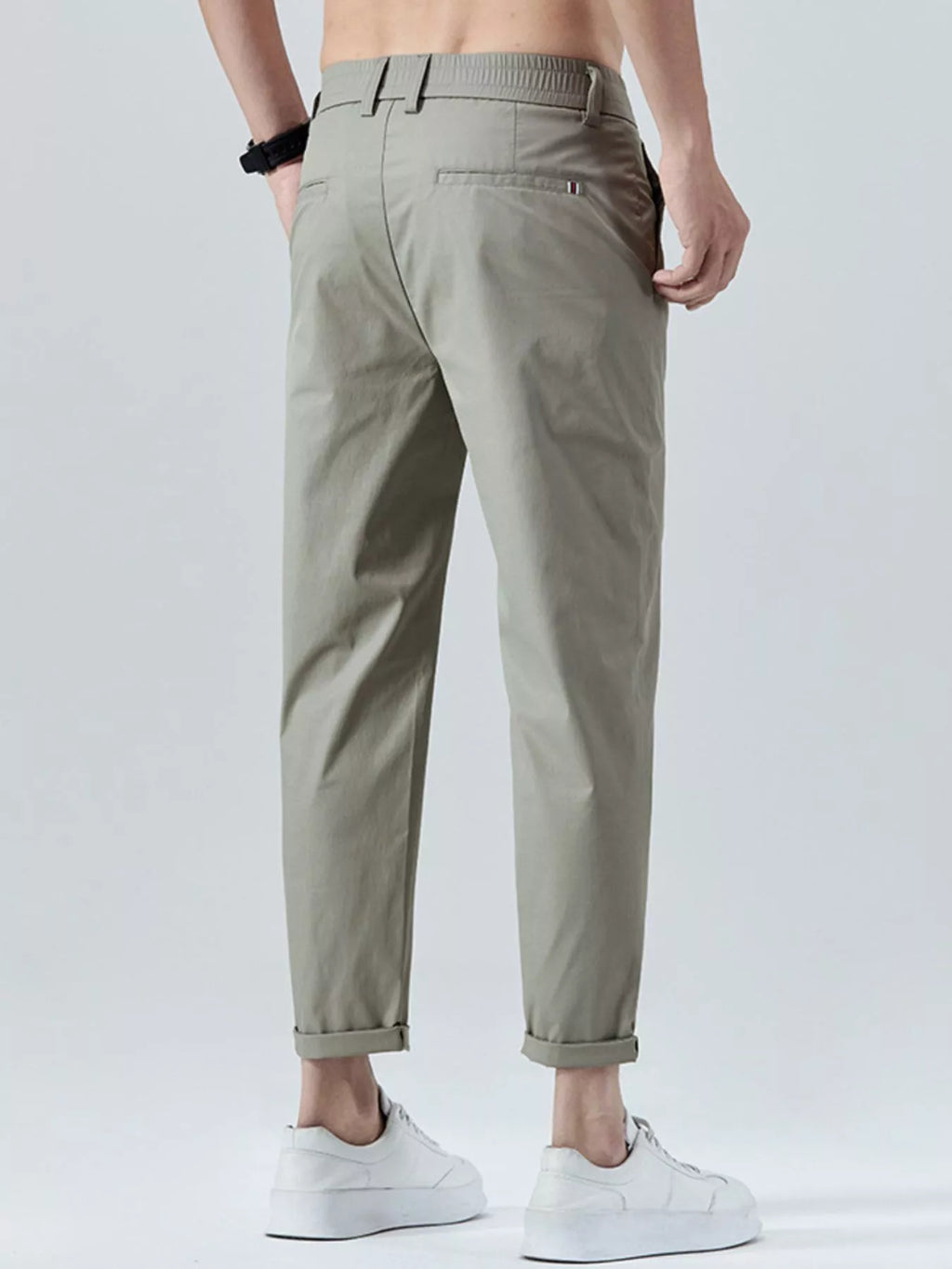 Men's straight-leg cropped pants in olive gray with front button closure and cuffed hem