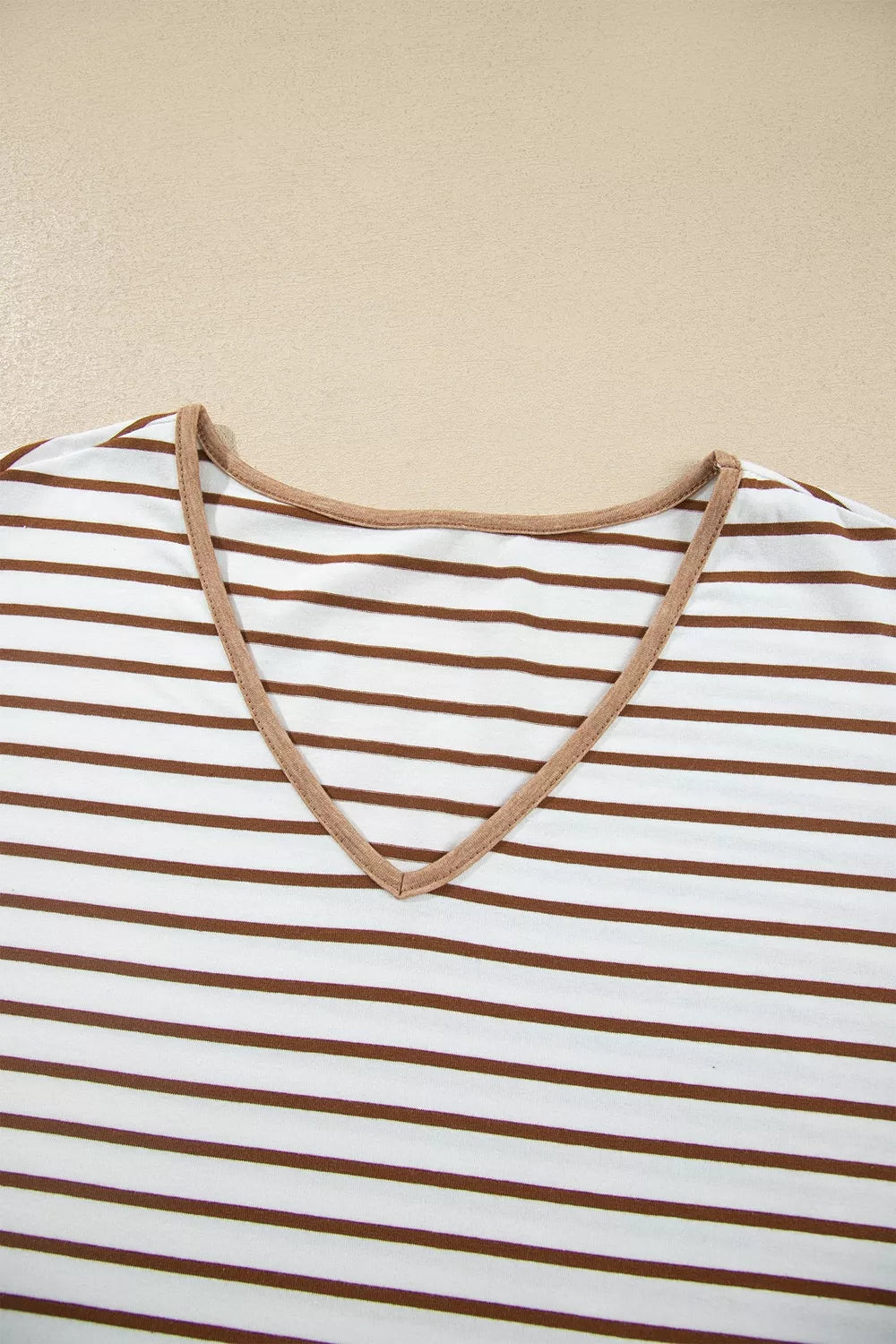 Striped V-neck ruffle sleeve top neckline with camel contrast trim