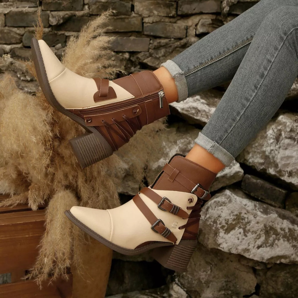 Two-tone point-toe ankle boots with buckled straps and textured block heel