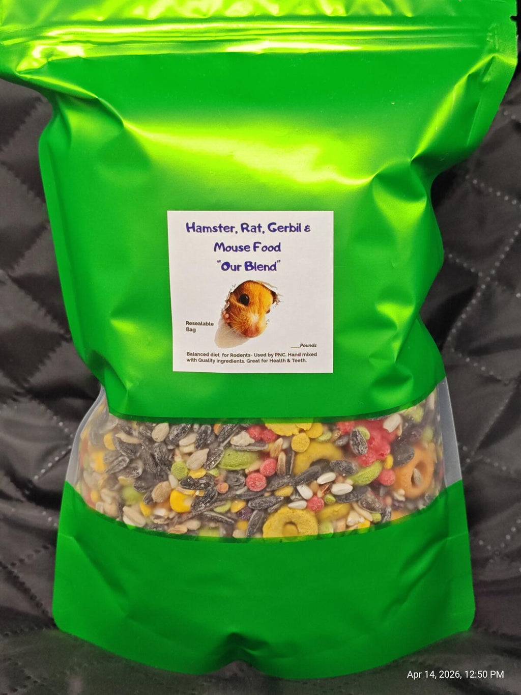 Green standing rodent food pouch, resealable, with label and visible kibble filling.