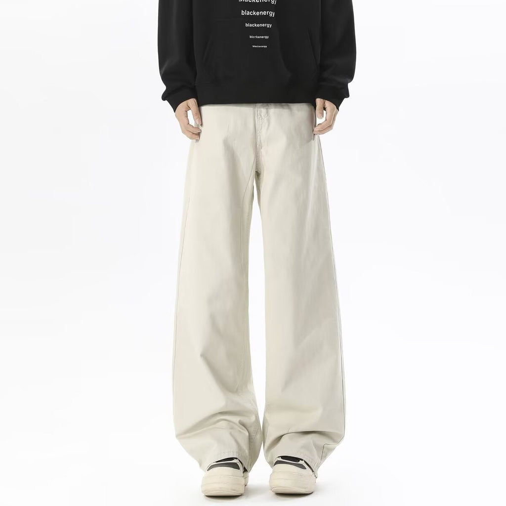 Beige cargo pants with straight wide legs and front pockets, long-length trousers